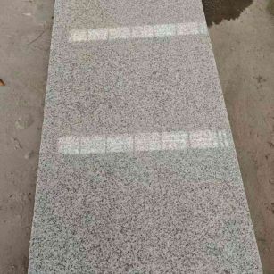 哈密芝麻白光面毛板